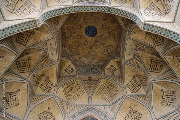 Fototapeta  the main attraction of the city, the heritage of Persia Jameh Mosque of Yazd. Elements of rich detailed decor.Decor, architecture and geometric patterns