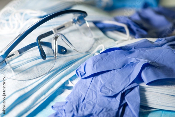 Fototapeta Pair of Safety Glasses, Masks And Gloves To Prevent The Spread Of Infection