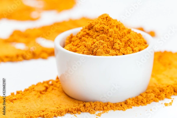 Obraz Turmeric in bowl. Selective focus.