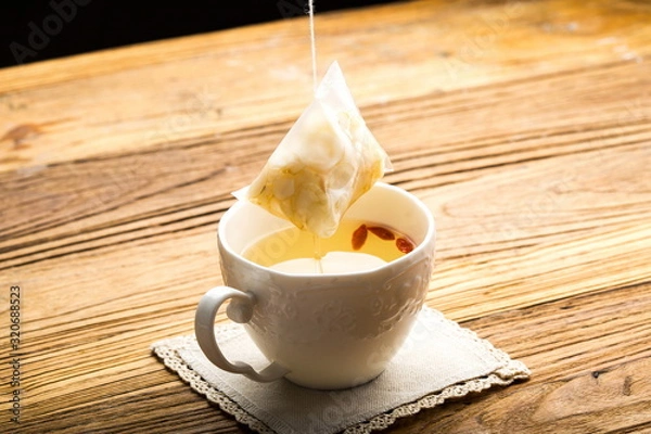 Fototapeta Ginseng has medicinal properties against a white background and can be dipped in water and sliced, also known as American ginseng-Panax quinquefolius