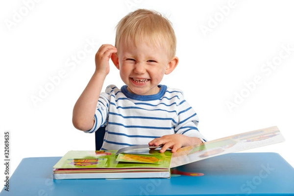 Obraz Kleinkind beim Buch ansehen