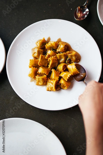Obraz Top Down View of Agnolotti Served on a Round Plate 
