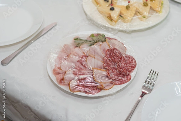 Fototapeta Catering for a banquet. Delivery of servings of food in packaging directly to the table.