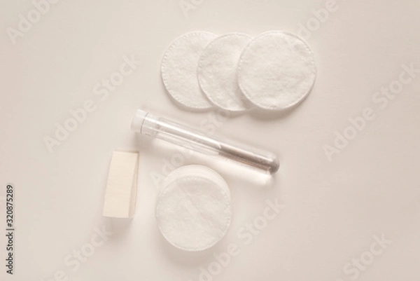 Fototapeta Concept of care face with micellar water and cotton pad top view. Hygiene for skin.