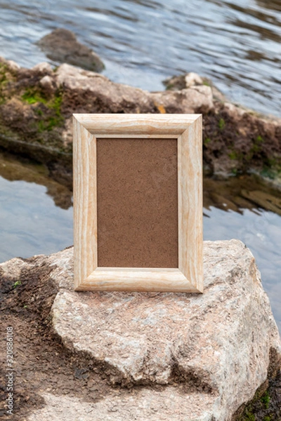 Obraz Empty Picture Frame on Rock in River