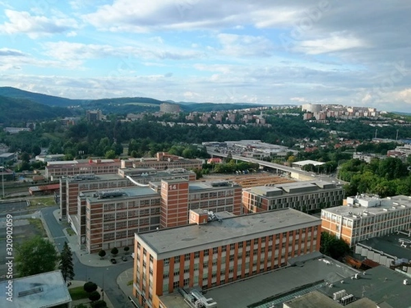 Fototapeta Zlin town, view of Zlin factory Svit and housing estate Jizni svahy, view from north