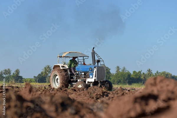 Fototapeta Technician maintenance of agricultural machinery working in the factory.