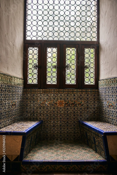 Obraz Spanish Style Benches made out of colorful tiles by a Window