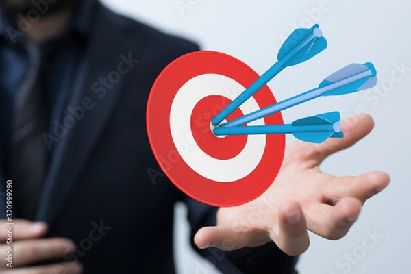 Fototapeta  makes a dart throw on the target. The concept of persistence in business..