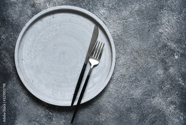 Fototapeta Table setting. Empty plate, knife, fork and napkin. Top view and flat lay with copy space