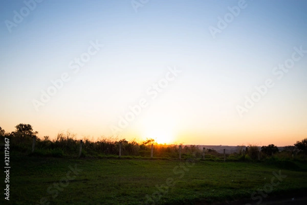 Obraz sunset over a field