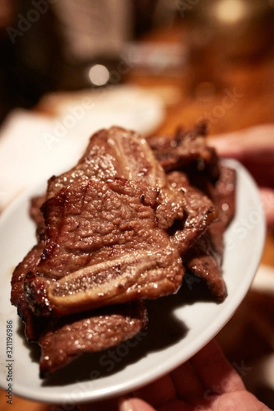 Obraz Korean Style BBQ Ribs served on an Oval Shaped Plate 