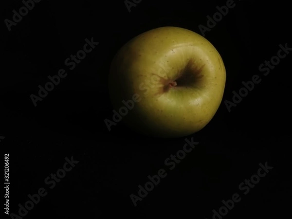 Obraz green apple on black background