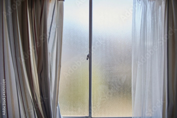 Fototapeta Frosty Window with Striped Curtains