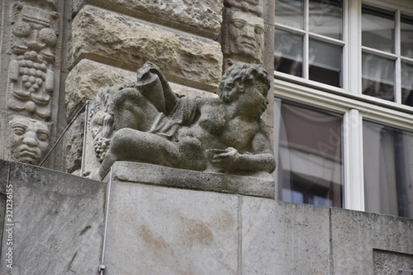 Fototapeta child sculpture made on a building wall