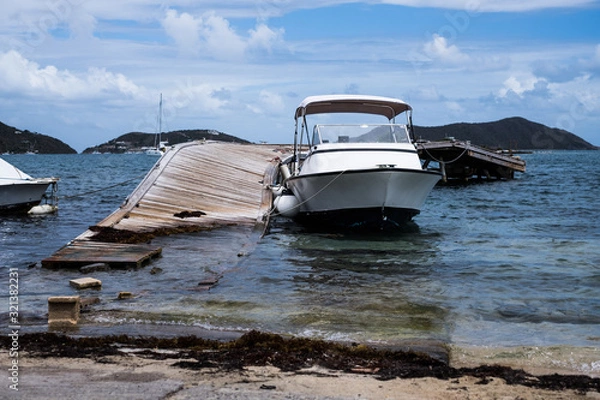 Fototapeta Wreckage on the coast of Tortola from hurricane damage. Restoration is a slow process on the island.