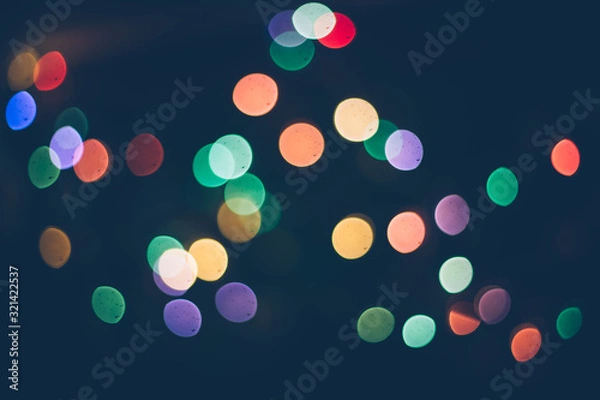 Obraz blur light bokeh color red green yellow on background black.