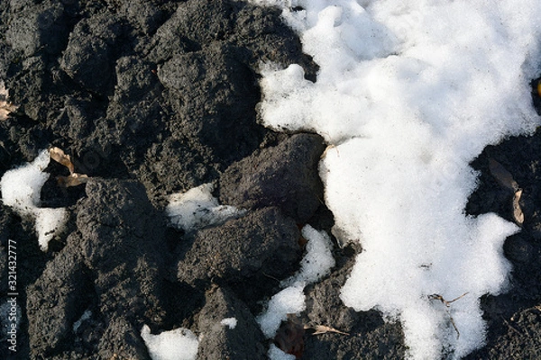 Obraz Brown, black ground surface with snow. Close up natural background.