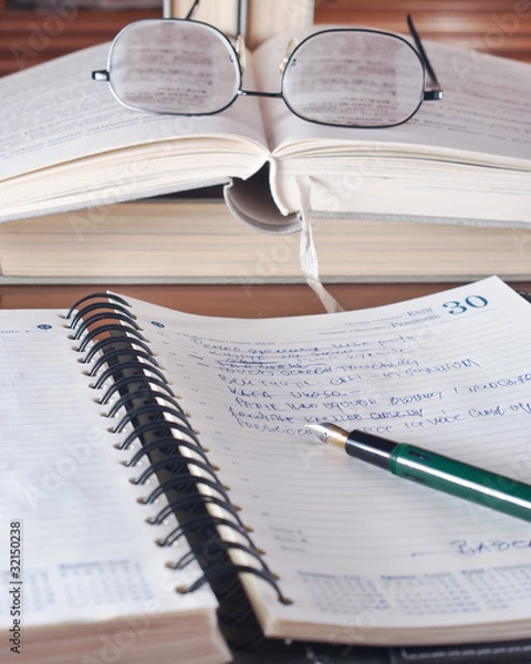 Obraz open workbook and pen