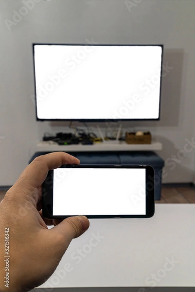 Obraz Cast smartphone on a tv concept