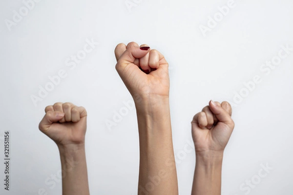 Fototapeta Together we stand ! Many clenched fists punch air energetically