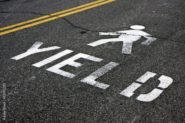 Obraz Pedestrian yield sign on a road