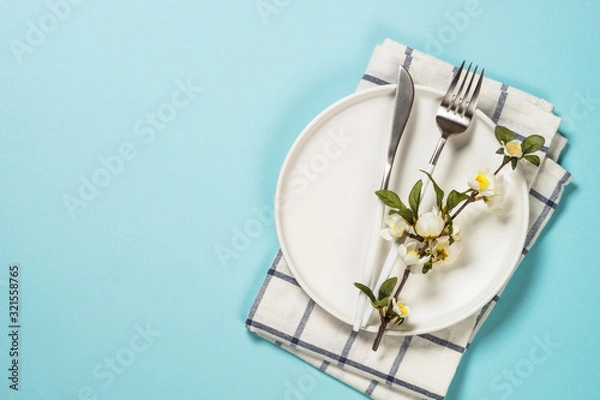 Fototapeta Spring table setting with flower top view.
