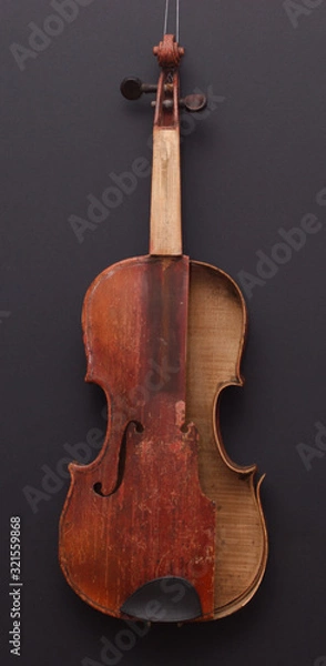Fototapeta Broken antique red violin for restoration with damage