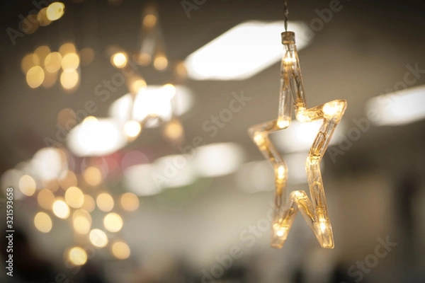 Obraz Golden star and light blur background.