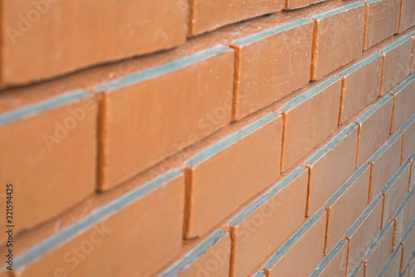 Fototapeta Close-up red brick usage for background, from the temple walls.