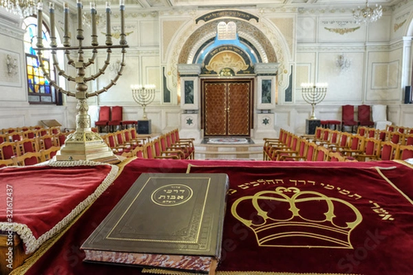 Obraz Holy book and menorah on altar in Moroccan synagogue.