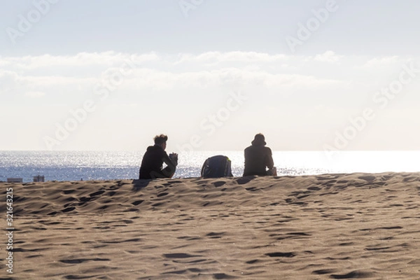 Fototapeta Resting on the top of a dune