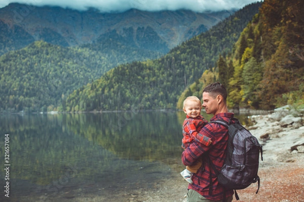 Obraz Dad and son walk by the lake
