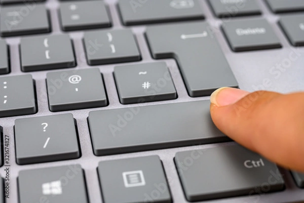 Obraz Finger pressing the shift key close up