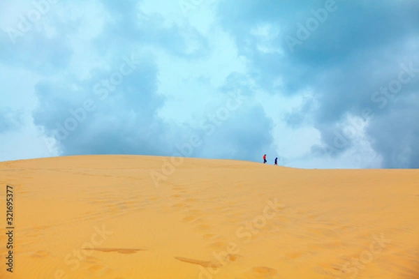 Fototapeta strangers on the top of sandy duna