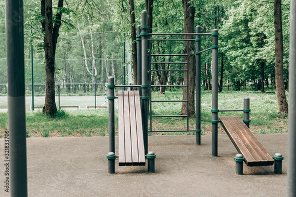 Obraz An empty training ground (workout) on the street, horizontal bars and benches for exercise on the press.