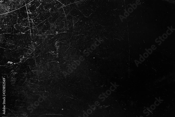 Fototapeta White scratches and dust on black background. Old dirty glass.
