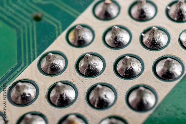 Fototapeta Soldered component pins on an LCD TV motherboard underside