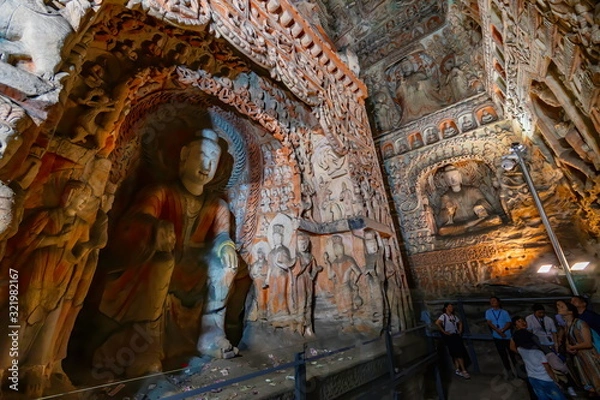 Obraz Painted caves with buddha and monk statues in niches. World cultural heritage site and Buddhist Caves Art Treasure Houses in Yungang Grottoes near Datong, Shanxi Province, China 