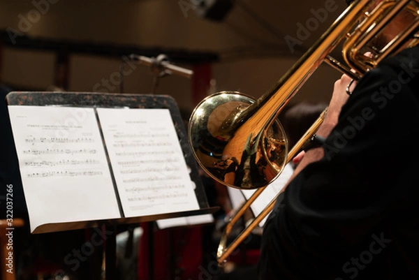 Obraz Trombone in the hands of musicians in the orchestra