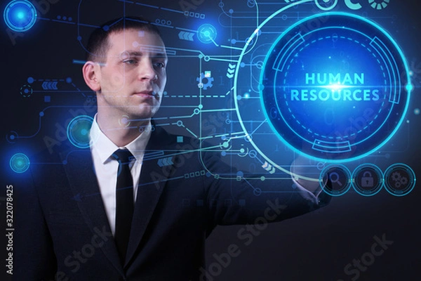 Fototapeta Business, Technology, Internet and network concept. Young businessman working on a virtual screen of the future and sees the inscription: Human resources