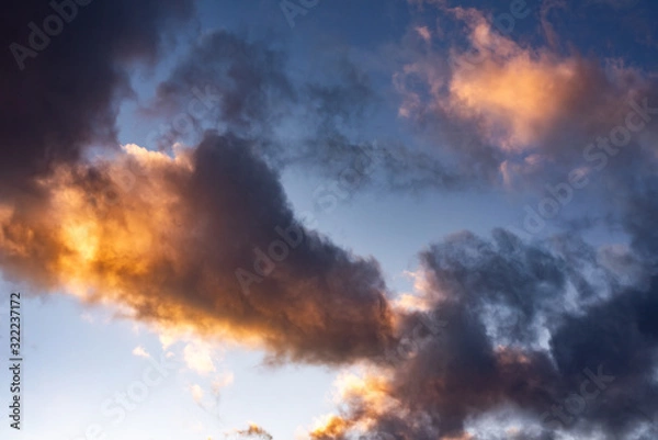Fototapeta Evening sky with black clouds. Evening sky with white clouds.