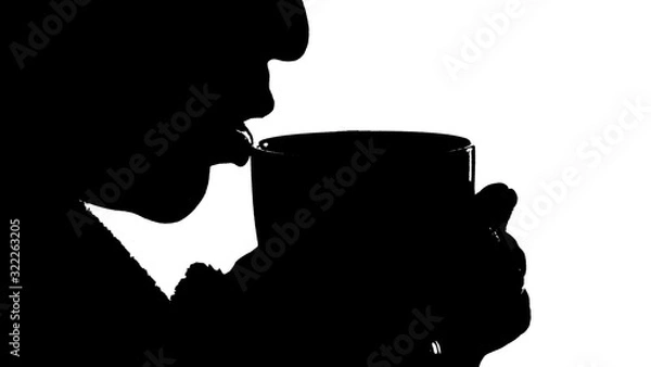 Obraz black silhouette of a girl on a white background who is drinking a hot drink from a mug