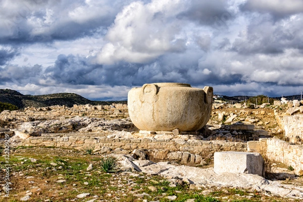 Fototapeta Massive stone vase in Amathus ruins, Cyprus under stormy clouds