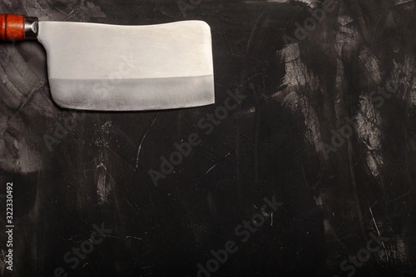 Fototapeta Chopping knives on a dark table. Space for text