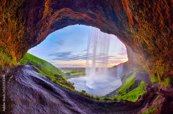 Obraz Incredible sunset on Seljalandsfoss. One of the most beautiful waterfalls on the Iceland, Europe. Popular and famous tourist attraction summer holiday destination in on South Iceland. Travel postcard