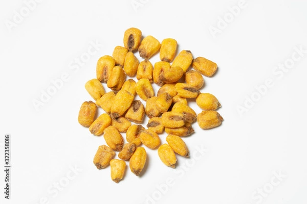 Fototapeta Roasted corn nuts on white background