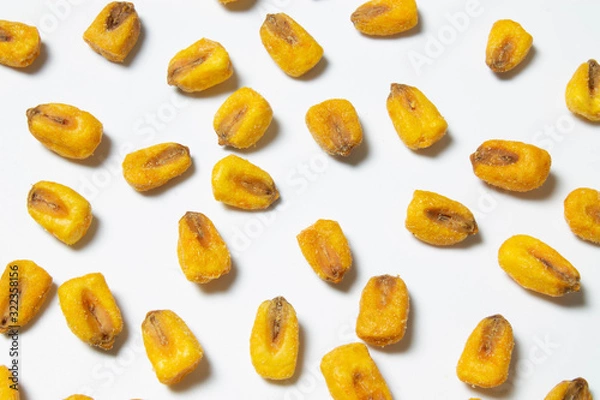 Fototapeta Roasted corn nuts on white background