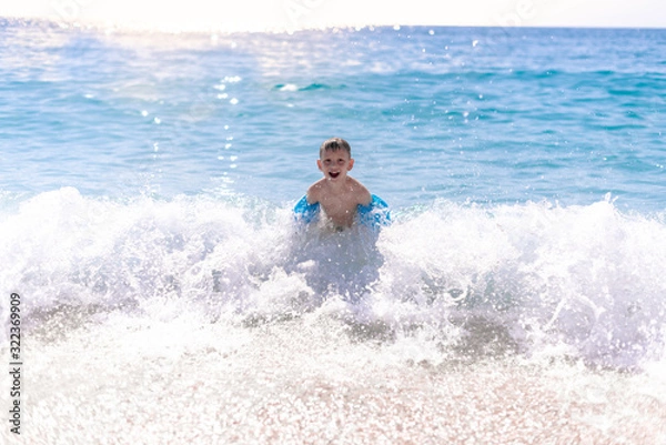 Obraz One boy is playing on the beach