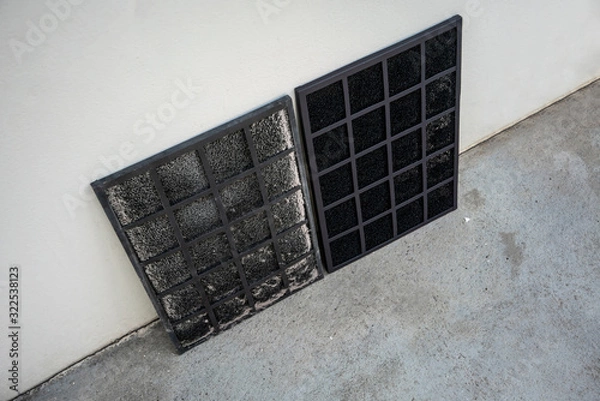 Fototapeta Comparing between old and new replaceable carbon air purifier filter
